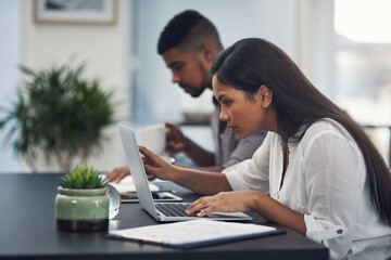 Woman, laptop and reading report in workplace, copywriting research and plan for website update....