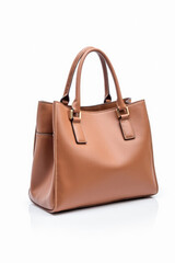 Naklejka premium Elegant brown leather handbag on white background for fashion design