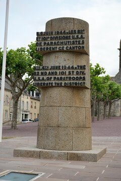 The monument to 82nd and 101st US Paratroops outside The Church of Sainte Mere Eglise. Sainte Mere Eglise, France, July 2023.  