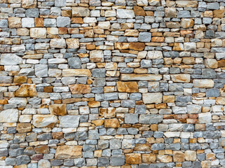 Obraz premium Stonewall background texture. building facade stone wall material