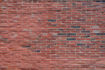 Obraz premium Brick wall background texture. Red color bricks, Building facade detail