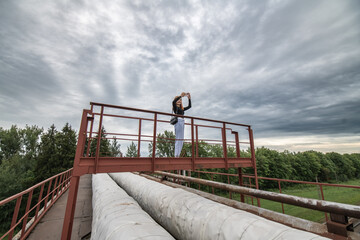 Portrait of a young beautiful girl in jeans in the summer outdoors.