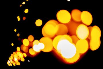 Abstract blue bokeh lights on a dark background, creating a serene and mystical atmosphere perfect...