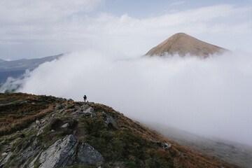 Cloud in a top mountain. Fog on the peak