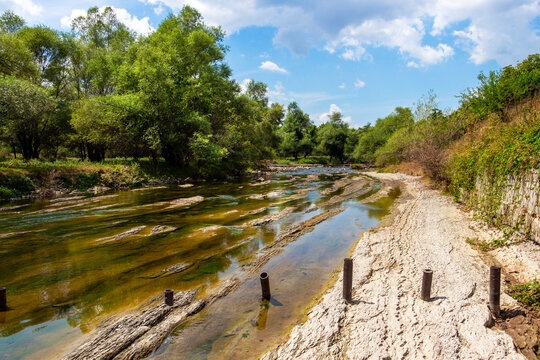 Sunny August view of the shallow waters of Vidima River in the Bulgarian Fore-Balkan village of Debnevo, Troyan Municipality