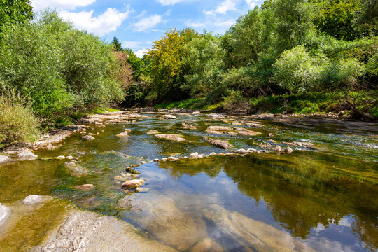 Sunny August view of the shallow waters of Vidima River in the Bulgarian Fore-Balkan village of Debnevo, Troyan Municipality