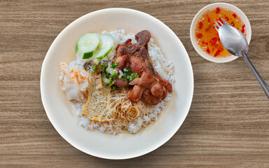 Broken rice with grilled pork chop, meatloaf and shredded pork skin. Vietnamese combination broken...