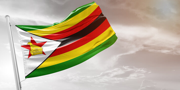 Zimbabwe national flag cloth fabric waving on beautiful grey Background.