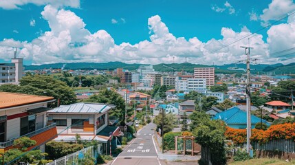 Obraz premium A Picturesque View of a Japanese Neighborhood with Blue Skies and Lush Greenery