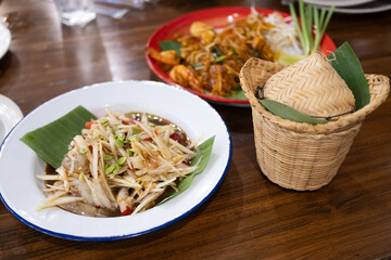 Savory thai cuisine preparation local restaurant food photography indoor setting close-up shot culinary experience
