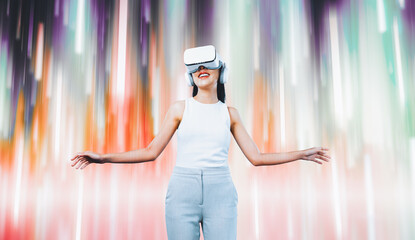 Female standing and wearing white VR headset and white sleeveless connect metaverse, future...