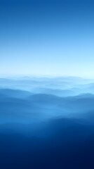 A serene gradient of blue hues, depicting soft undulating waves across a vast horizon, creating a calm and tranquil atmosphere that invites reflection.