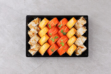Japanese sushi rolls, sushi sets on a gray background for restaurant menu and food delivery