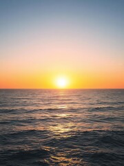 Fototapeta premium Vibrant sunset over the ocean with a beautifully curved horizon, ocean, reflections
