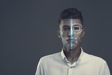 Facial and iris recognition system. Man undergoing biometric verification on grey background