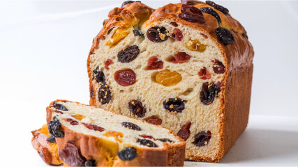 Fruit Loaf Bread: A golden-brown loaf filled with raisins, dried fruits, and candied fruit, sliced...