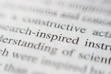 Macro Shot of the Word Inspired on a Book Page