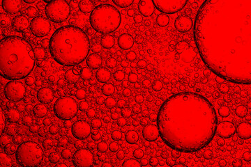 Red drink bubbles macro,water drops on red background with place for text,Close up macro bright...