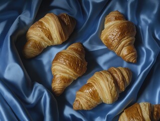 Flaky Croissants on Blue Cloth