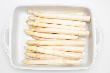 Freshly harvested white asparagus neatly arranged and prepared for cooking to bring out its delicious flavors