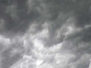 Fototapeta premium Atmospheric dark gray storm with dramatic clouds in the sky creating a gloomy and anxious mood before the thunderstorm