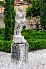 Obraz premium a marble stature in the beautiful and unique city garden called Giardino Giusti in Verona, Italy. 