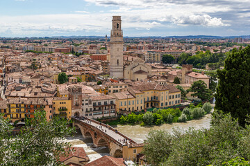 Obraz premium panoramic view down to the river Etsch with the Ponte Pietra bridge and the Santa Maria Matricolare duomo
