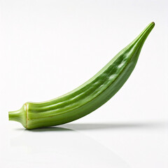 Fototapeta premium A single, vibrant green okra pod lies on a white background