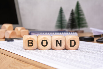 The BOND Concept Represented with Wooden Blocks Displayed on a Professional Desk Surface