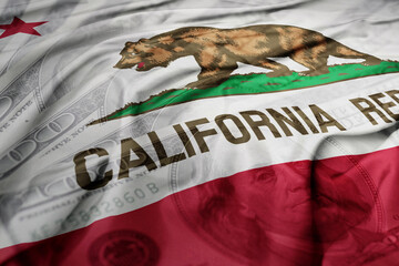 waving colorful california state flag on the dollar money background. finance concept.