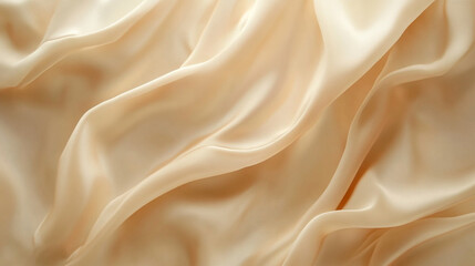 Obraz premium Elegant beige silk fabric draping softly with gentle waves in natural light