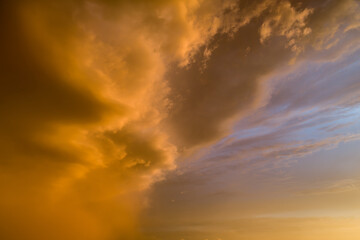 The sky is orange and cloudy