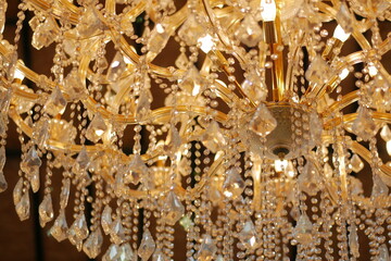 Elegant chandelier indoor space decorative lighting luxurious ambiance close-up view home decor...