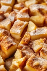 Classic apple tart with dusted cinnamon apple slices on rustic background