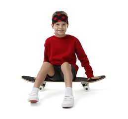 Little boy with skateboard on white background