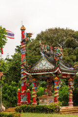 A Colorful Traditional Pavilion, Beautifully Designed, Surrounded by Lush Greenery and Nature