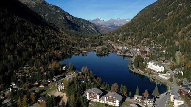 Amazing aerial autumn drone footage of mountains, lake and village at Champex-Lac in the Swiss Alps in the Canton of Valais