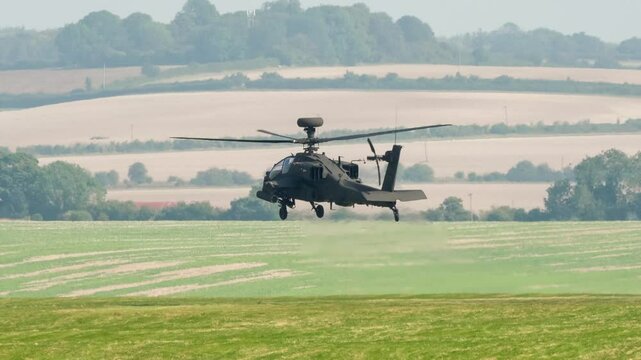 British army Boeing Apache Attack helicopter gunship AH64E AH-64E ArmyAirCorp AAC AH2 maintains hover 4m off a grass meadow