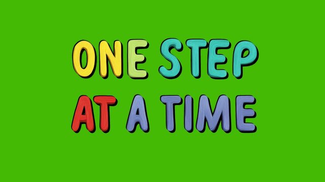Positive motivational phrase “One step in a time” colorful frase on green screen chroma key background