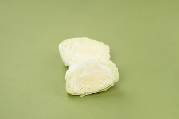 Fresh ripe cabbage vegetable isolated on a green background