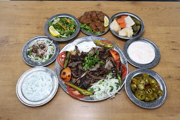 The most common variety of kebab is marinated lamb or beef cooked on a skewer. Vegetables are sometimes cooked along with them, wherein typical vegetables include eggplant, tomato, bell pepper, onions