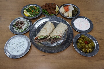 The most common variety of kebab is marinated lamb or beef cooked on a skewer. Vegetables are sometimes cooked along with them, wherein typical vegetables include eggplant, tomato, bell pepper, onions