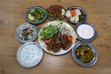 The most common variety of kebab is marinated lamb or beef cooked on a skewer. Vegetables are sometimes cooked along with them, wherein typical vegetables include eggplant, tomato, bell pepper, onions