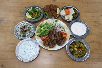 The most common variety of kebab is marinated lamb or beef cooked on a skewer. Vegetables are sometimes cooked along with them, wherein typical vegetables include eggplant, tomato, bell pepper, onions