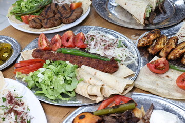 The most common variety of kebab is marinated lamb or beef cooked on a skewer. Vegetables are sometimes cooked along with them, wherein typical vegetables include eggplant, tomato, bell pepper, onions