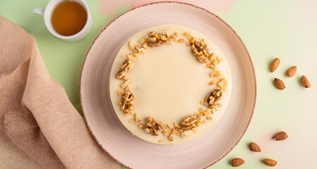 white chocolate cake with nuts on a plate