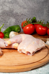 Chicken wings. Peeled raw chicken wings on a wood serving board. Close up