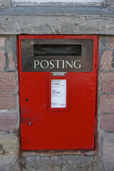 Beauly, Inverness County, Scotland: A traditional mailbox found in the United Kingdom, installed in a stone wall.
