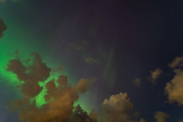 Photo background, night starry sky, clouds and northern lights.