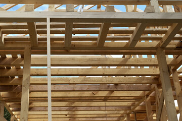 Elements of wooden frame house building structure.